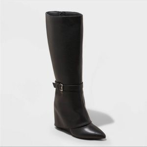 Tall black pointed boots